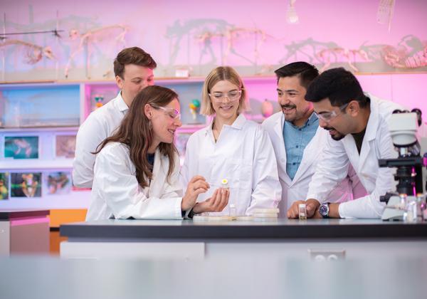 Group of young people in a lab. 